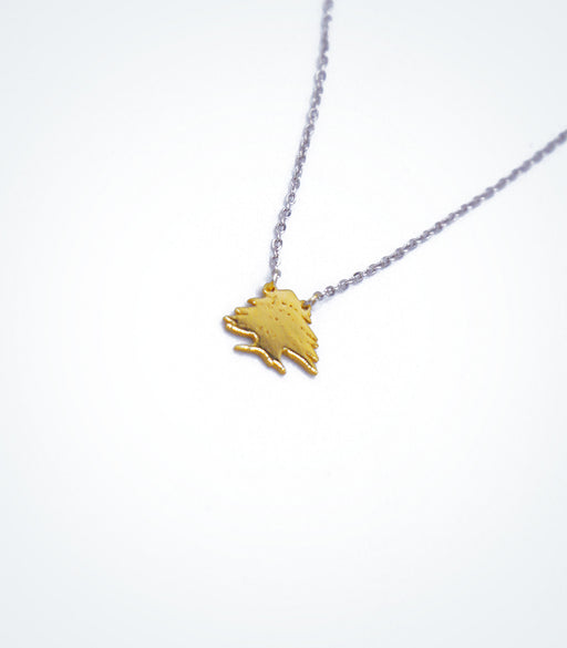 Yellow gold Cedar Tree motif with a white gold chain necklace