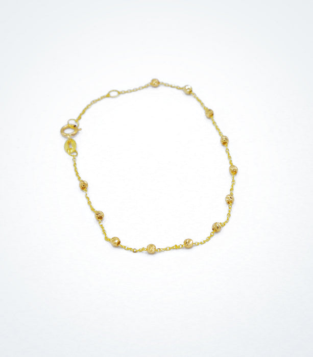 Yellow gold bracelet with yellow diamond cut ball beads