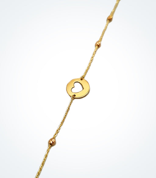 Yellow gold heart motif bracelet with gold ball bead accessorized on each side