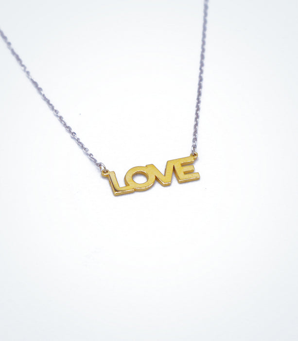 Yellow gold LOVE motif with a white gold chain necklace