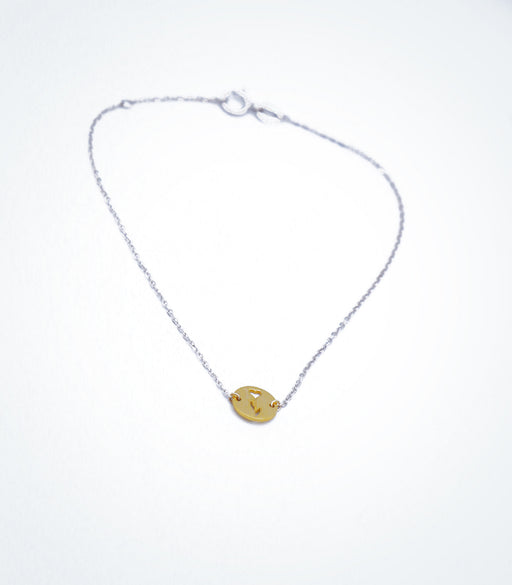 Yellow gold Flower Heart motif with a white gold chain bracelet