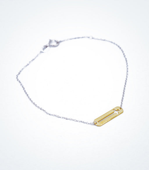 Yellow gold Plaque Cross motif with a white gold chain bracelet