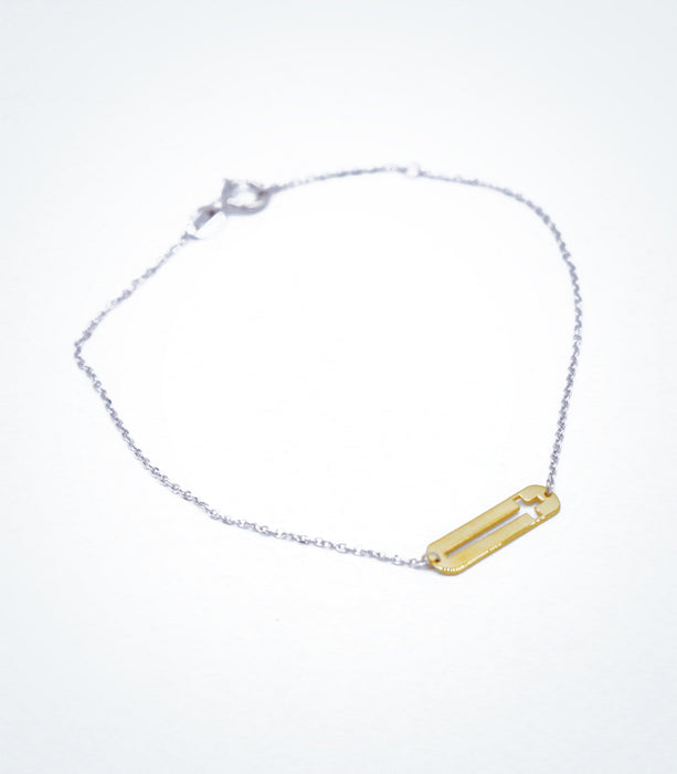 Yellow gold Plaque Cross motif with a white gold chain bracelet