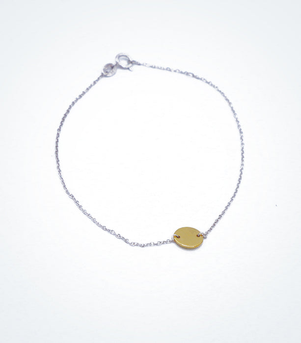Yellow gold Solid Circle motif with a white gold chain bracelet