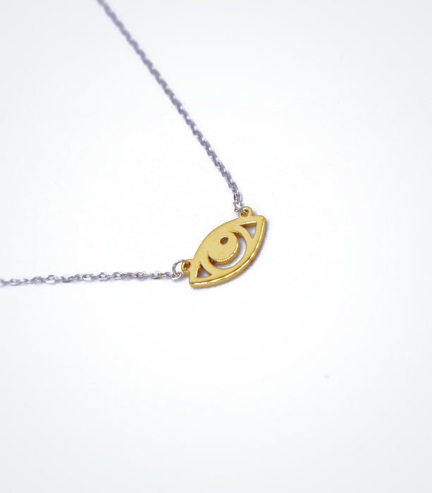 Yellow gold Evil Eye motif with a white gold chain bracelet