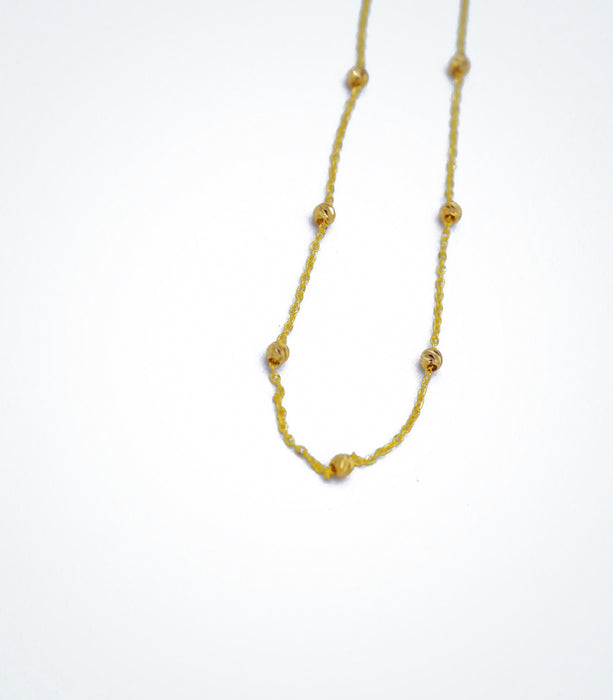 Yellow gold necklace with yellow diamond cut ball beads