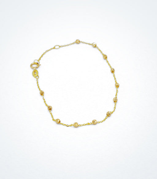 Yellow gold bracelet with yellow diamond cut ball beads