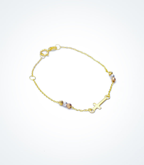 Yellow gold bracelet with a small Cross and colored ball beads
