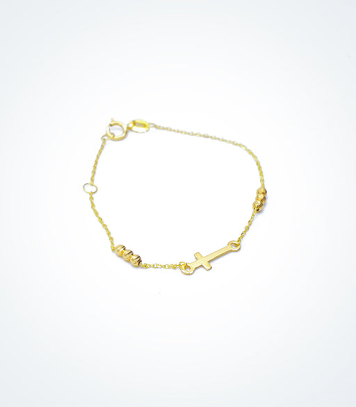 Yellow gold children's bracelet with a small Cross and yellow gold ball beads
