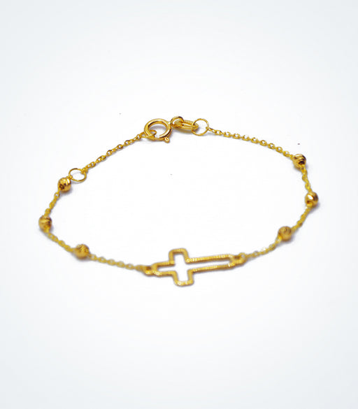 Yellow gold children's bracelet with an outline Cross and yellow ball beads