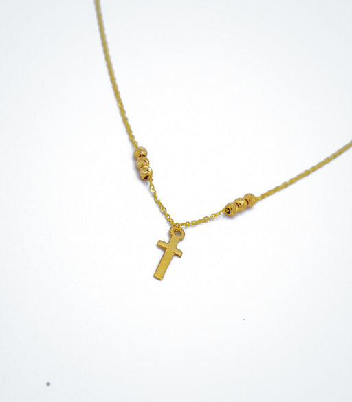 Yellow gold children's necklace with a small cross and yellow gold ball beads